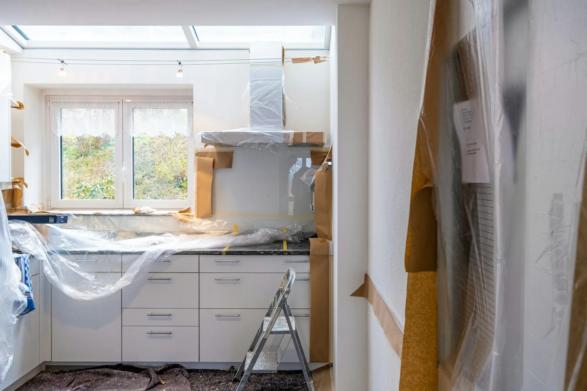 Kitchen remodel underway with open walls and new cabinetry